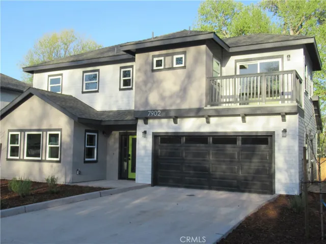 a front view of a house with a garage