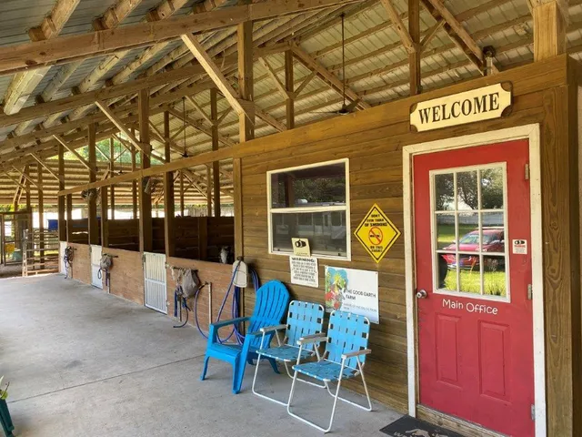 a view of a chairs with table in front of house
