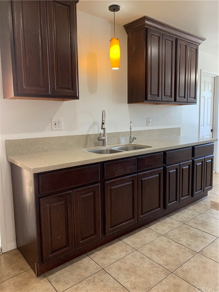 8216 Wilbarn Street Paramount, CA 90723 - Photo 14 of 27 a bathroom with a sink and a mirror