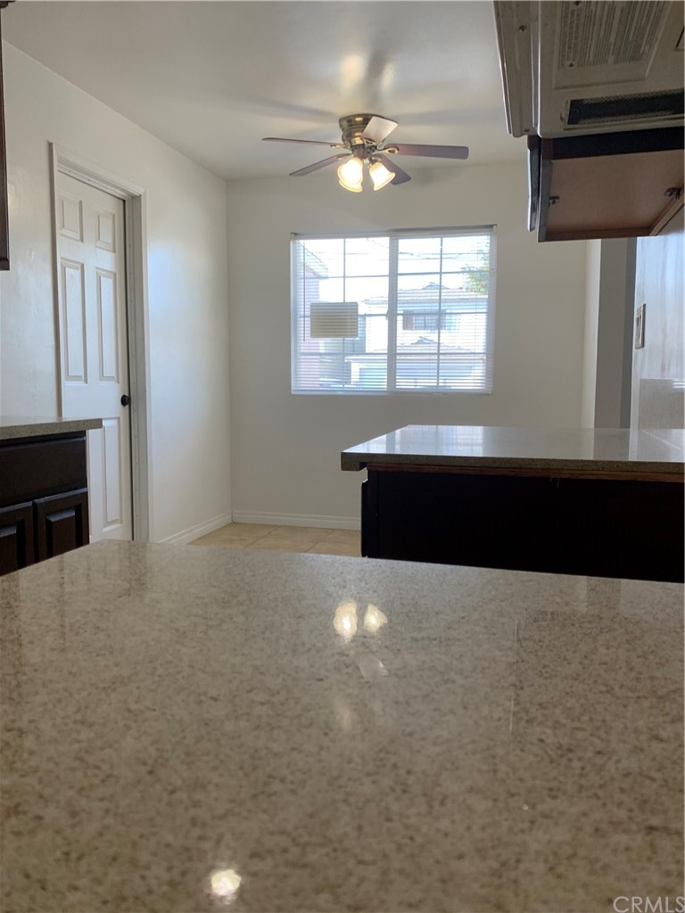 8216 Wilbarn Street Paramount, CA 90723 - Photo 16 of 27 an empty room with windows and ceiling fan