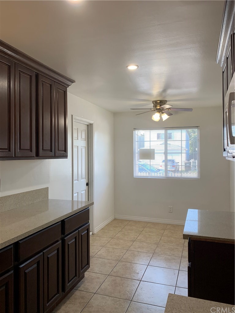 8216 Wilbarn Street Paramount, CA 90723 - Photo 17 of 27 a view of a kitchen with an empty space and a window