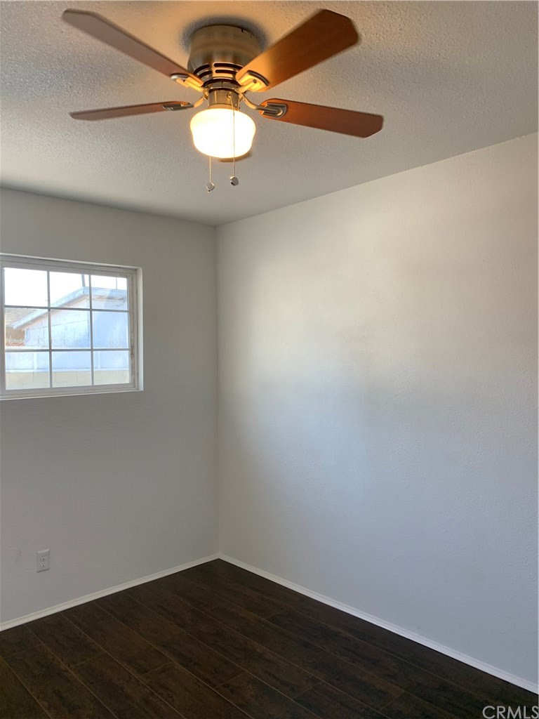 8216 Wilbarn Street Paramount, CA 90723 - Photo 18 of 27 wooden floor in an empty room
