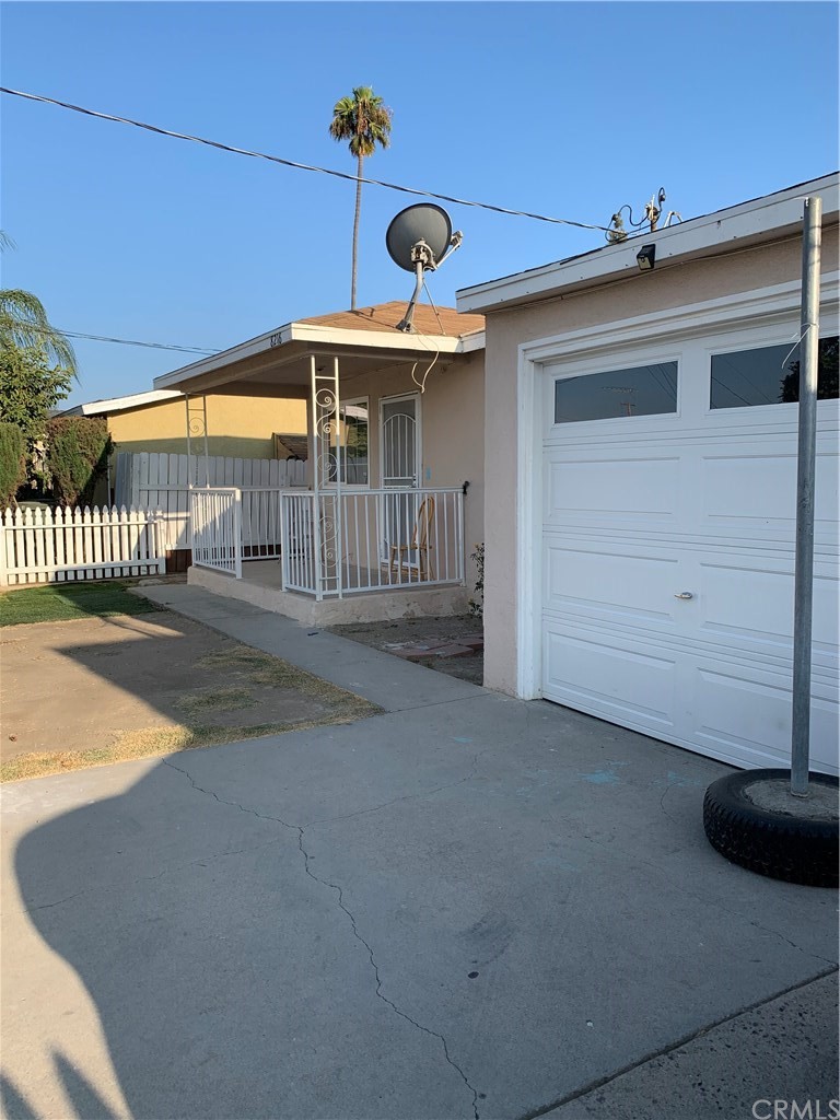 8216 Wilbarn Street Paramount, CA 90723 - Photo 4 of 27 a view of a house with a backyard