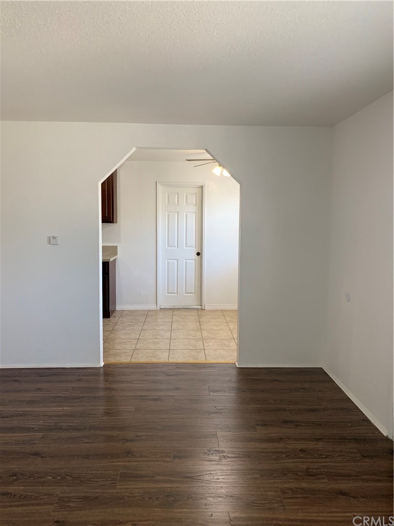 8216 Wilbarn Street Paramount, CA 90723 - Photo 9 of 27 a view of empty room with wooden floor