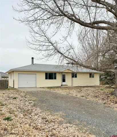 a house with trees in front of it