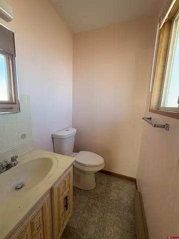 a view of a wooden fence and trees