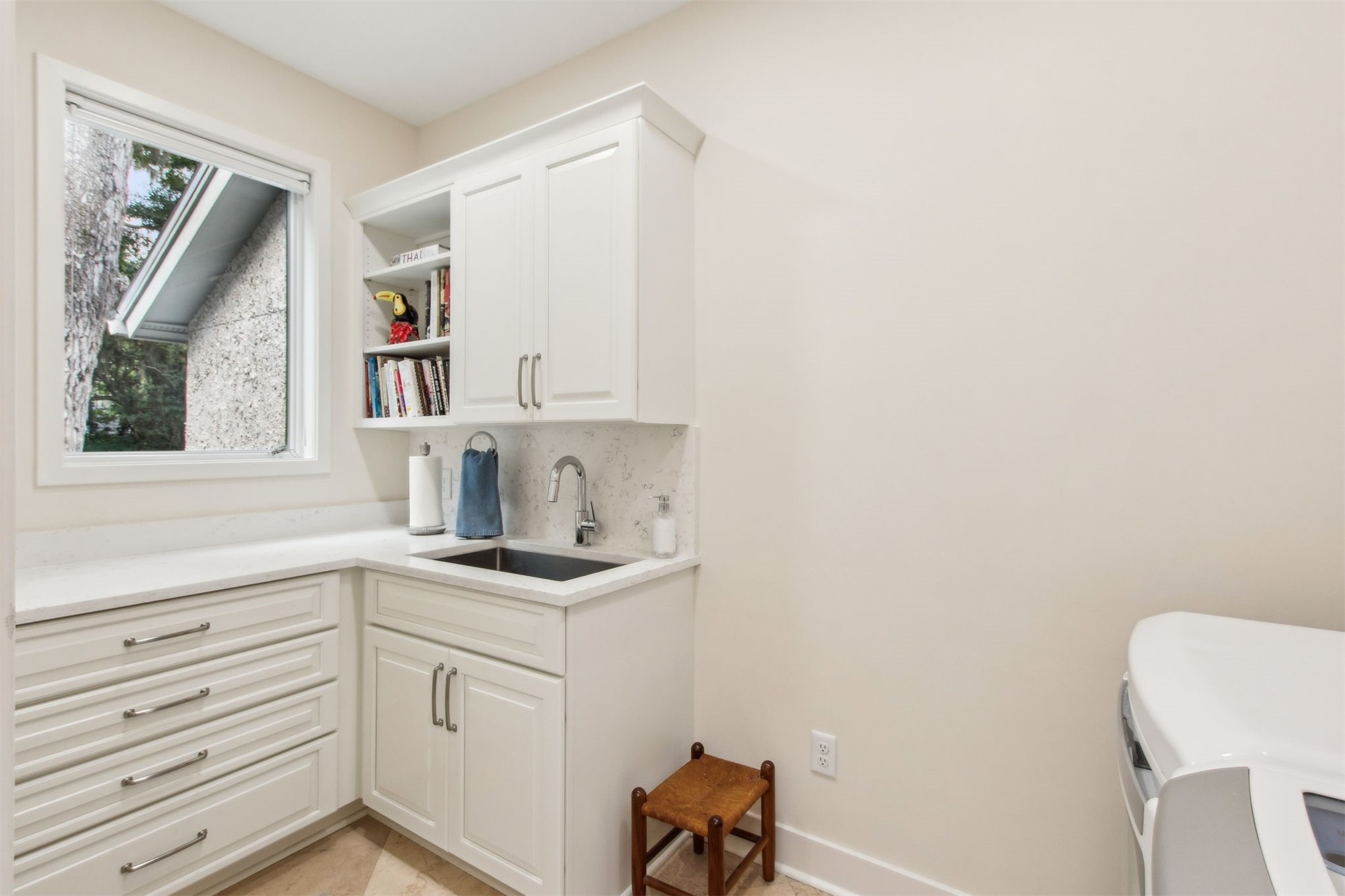 8 Marsh Hawk Road Amelia Island, FL 32034 - Photo 21 of 69 a kitchen with a sink cabinets and a window