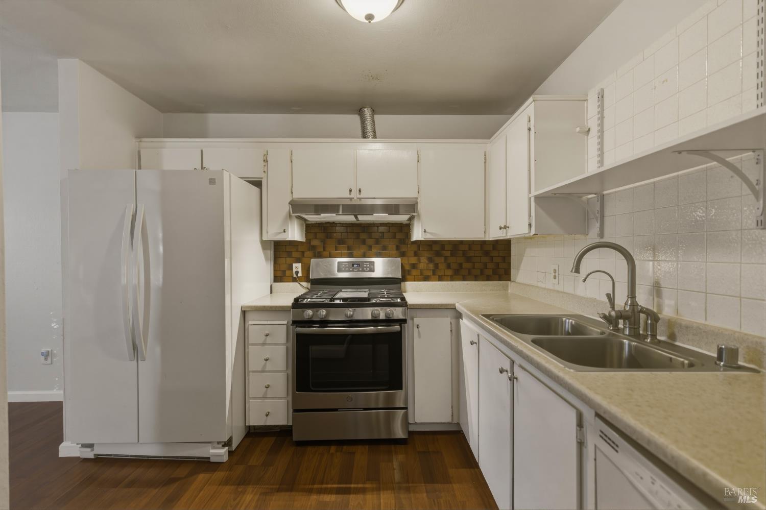 1741 Las Raposas Court Santa Rosa, CA 95409 - Photo 15 of 27 a kitchen with stainless steel appliances granite countertop a sink stove and refrigerator