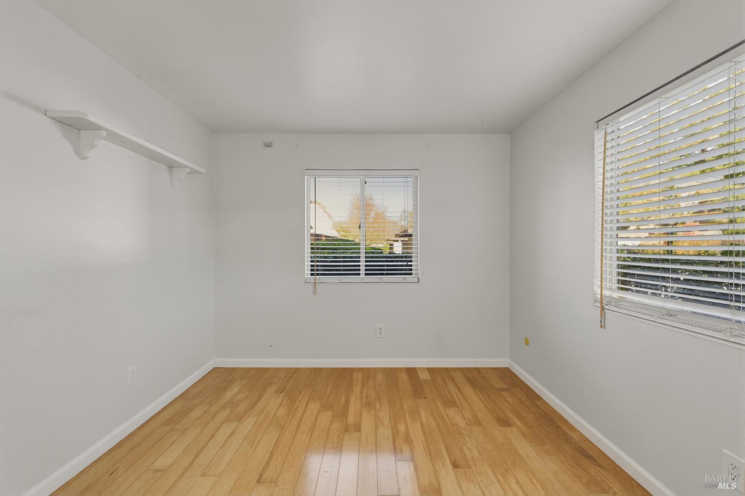 1741 Las Raposas Court Santa Rosa, CA 95409 - Photo 20 of 27 a view of an empty room with wooden floor and a window