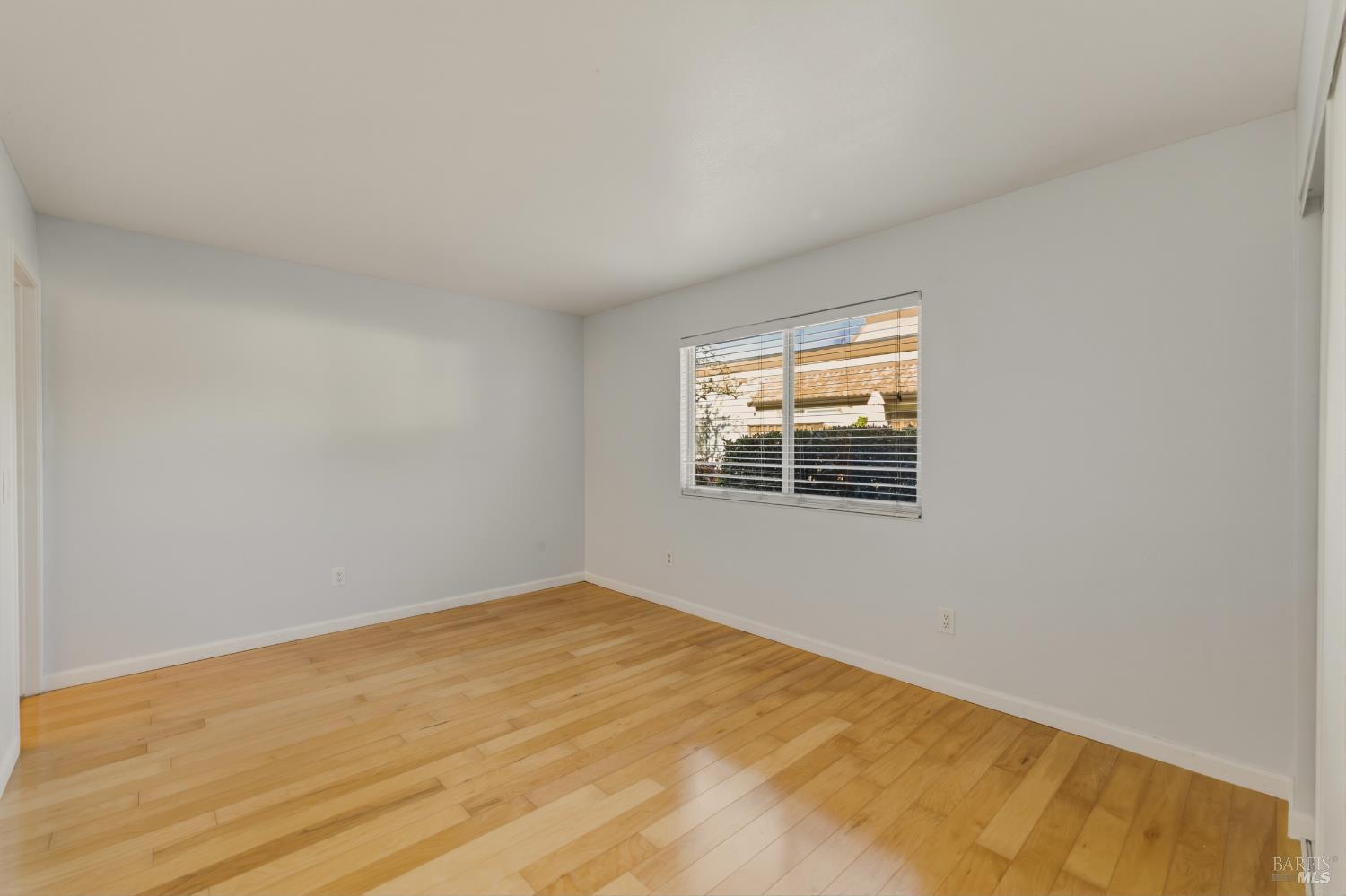 1741 Las Raposas Court Santa Rosa, CA 95409 - Photo 21 of 27 a view of an empty room with wooden floor and a window
