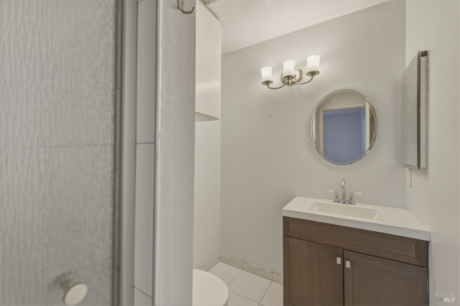 1741 Las Raposas Court Santa Rosa, CA 95409 - Photo 23 of 27 a bathroom with a sink and a mirror