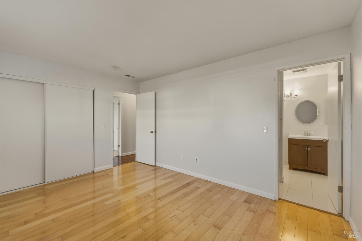 1741 Las Raposas Court Santa Rosa, CA 95409 - Photo 24 of 27 a view of empty room with wooden floor and fan