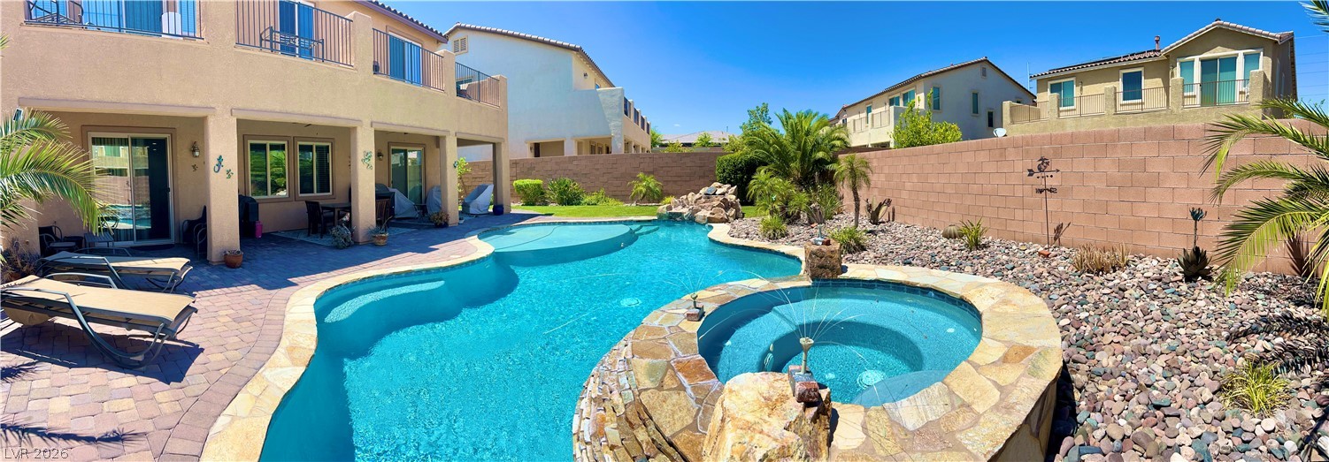 9724 University Ridge Avenue Las Vegas, NV 89149 - Photo 32 of 61 A tranquil oasis awaits, complete with a sparkling pool and inviting spa.
