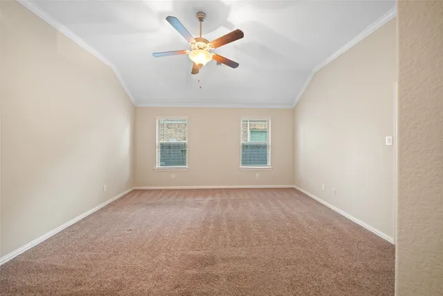 a living room with furniture a ceiling fan and a rug