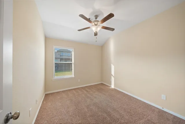 a spacious bathroom with a shower sink and mirror