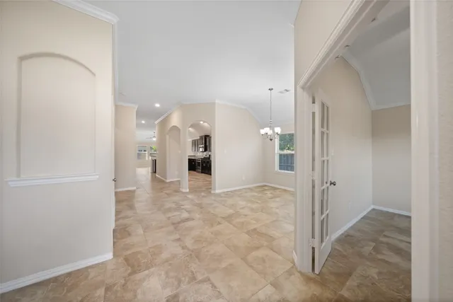 a front view of a house with a garden and yard