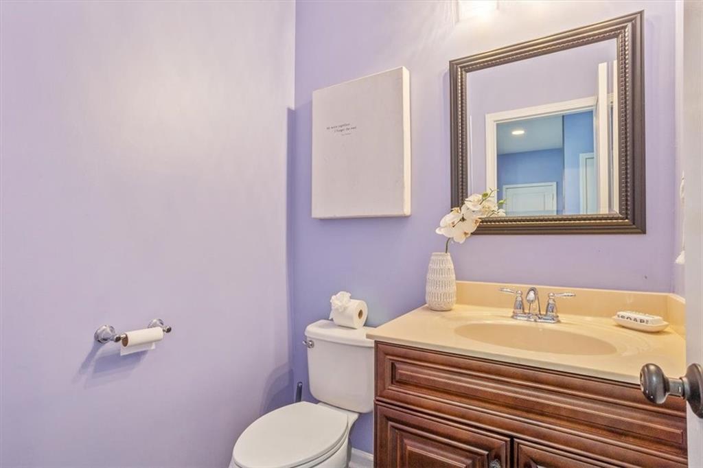 211 Parc Drive Canton, GA 30114 - Photo 11 of 62 a bathroom with a sink a toilet and mirror