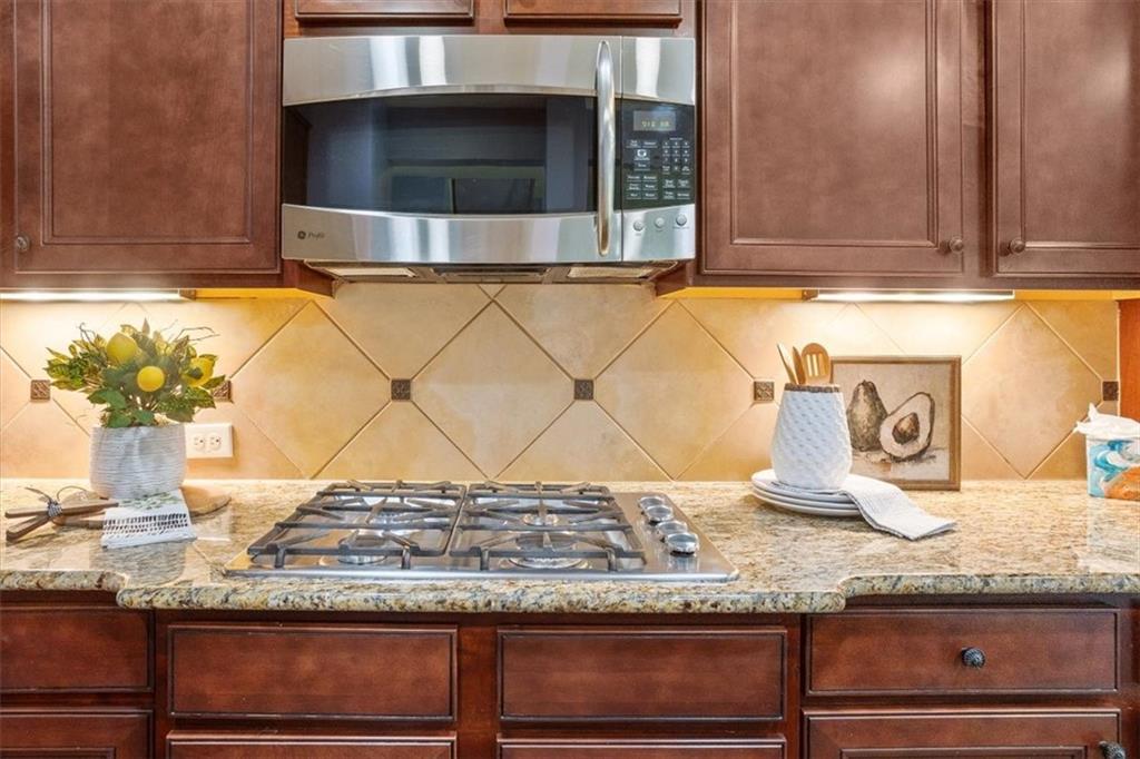 211 Parc Drive Canton, GA 30114 - Photo 17 of 62 a kitchen with granite countertop a sink and a white cabinets