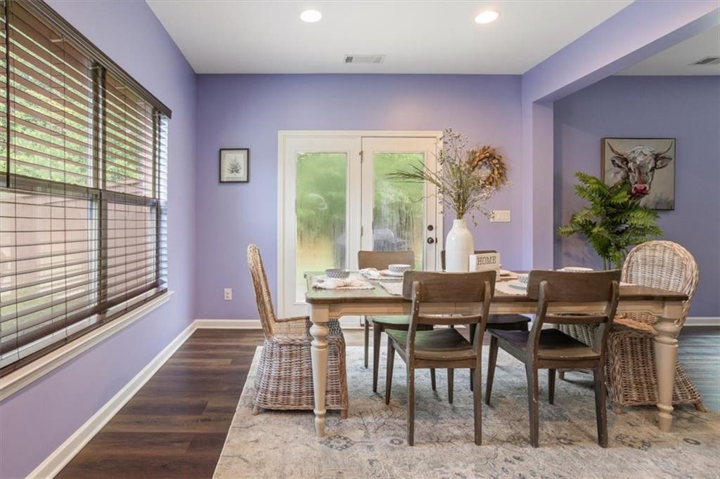 211 Parc Drive Canton, GA 30114 - Photo 18 of 62 a view of a dining room with furniture a chandelier and wooden floor