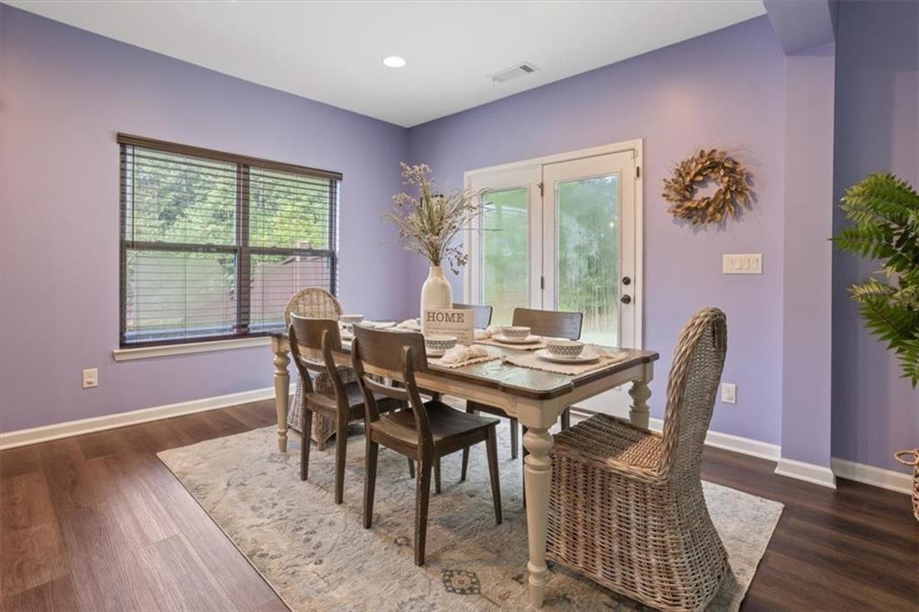 211 Parc Drive Canton, GA 30114 - Photo 19 of 62 a view of a dining room with furniture window and wooden floor