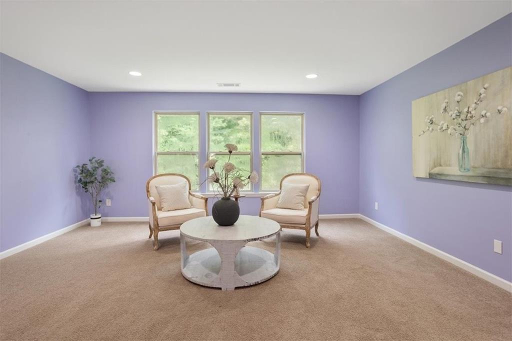 211 Parc Drive Canton, GA 30114 - Photo 26 of 62 a living room with furniture and a potted plant