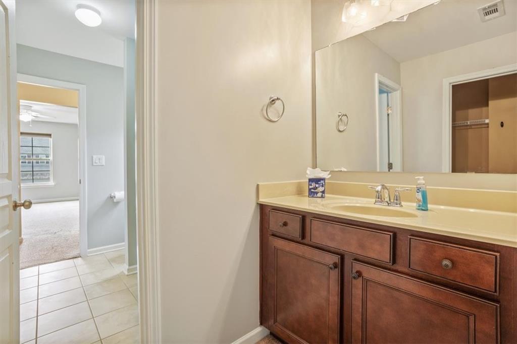 211 Parc Drive Canton, GA 30114 - Photo 35 of 62 a bathroom with a sink and a mirror