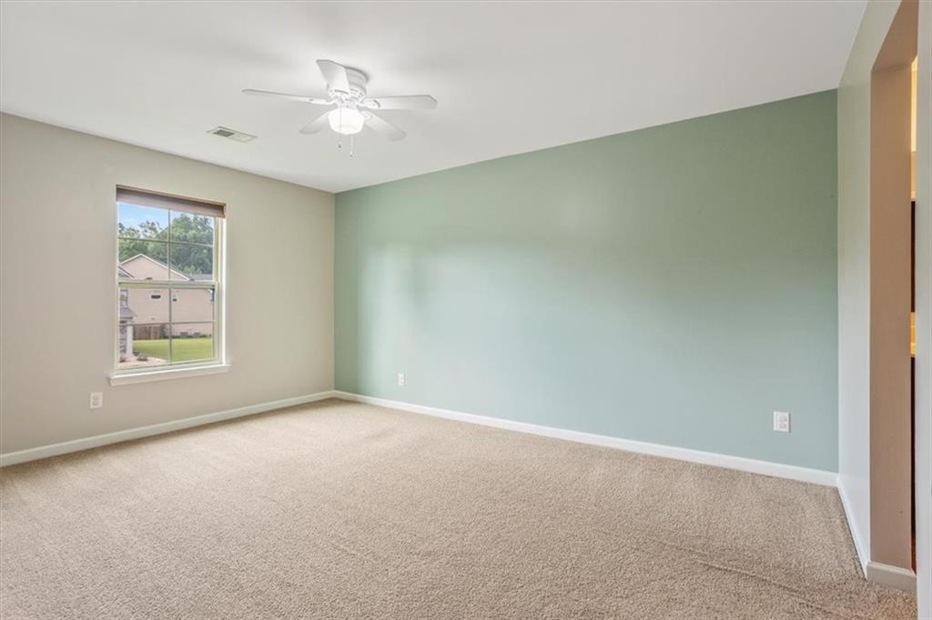 211 Parc Drive Canton, GA 30114 - Photo 38 of 62 an empty room with windows and fan