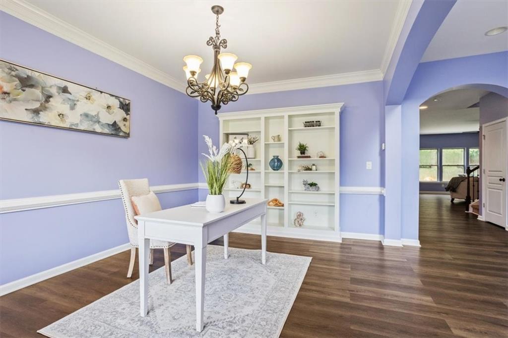211 Parc Drive Canton, GA 30114 - Photo 4 of 62 a view of a dining room with furniture and wooden floor