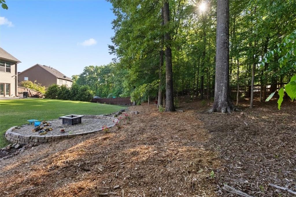 211 Parc Drive Canton, GA 30114 - Photo 47 of 62 a view of a park with large trees and plants