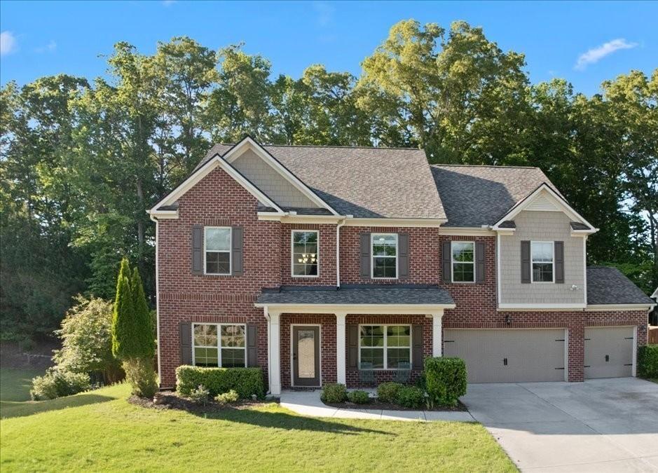 211 Parc Drive Canton, GA 30114 - Photo 49 of 62 a front view of a house with a yard