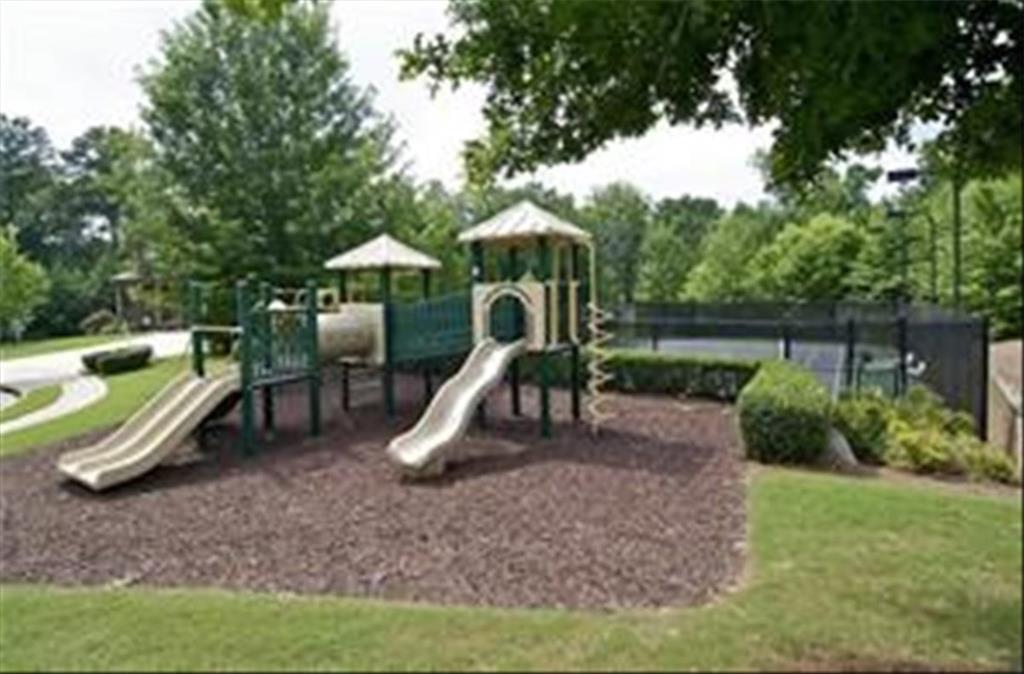 211 Parc Drive Canton, GA 30114 - Photo 57 of 62 a wooden deck with a slide and swing