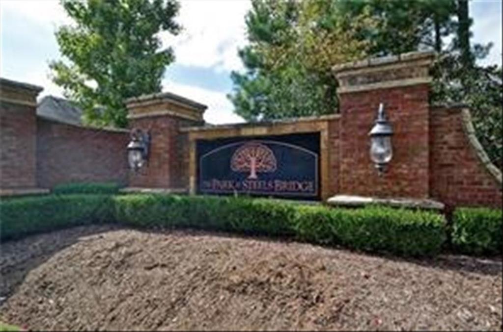 211 Parc Drive Canton, GA 30114 - Photo 58 of 62 a front view of a house with garden