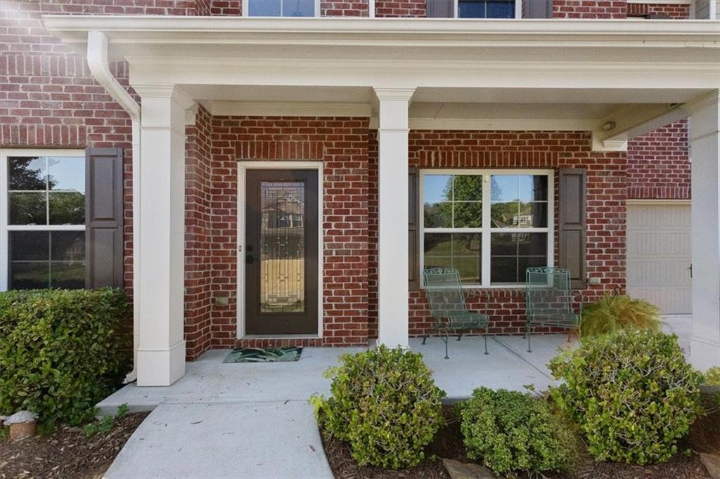 211 Parc Drive Canton, GA 30114 - Photo 8 of 62 a front view of a house with a yard