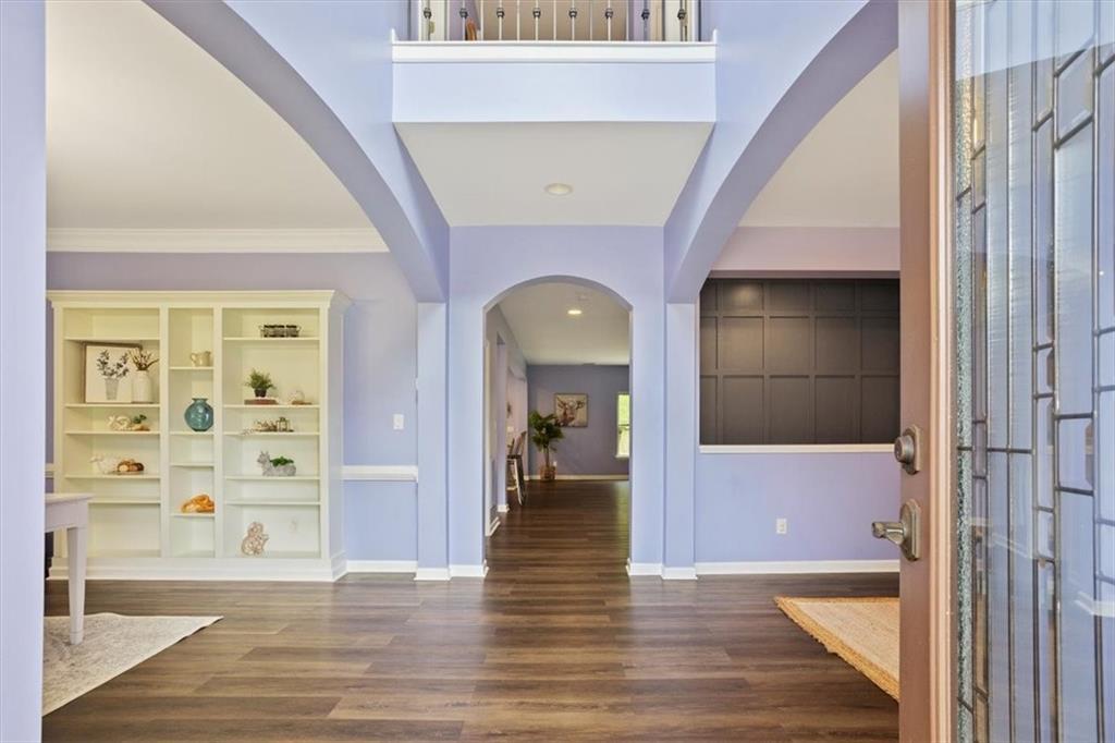 211 Parc Drive Canton, GA 30114 - Photo 9 of 62 a view of a hallway with wooden floor windows and entryway