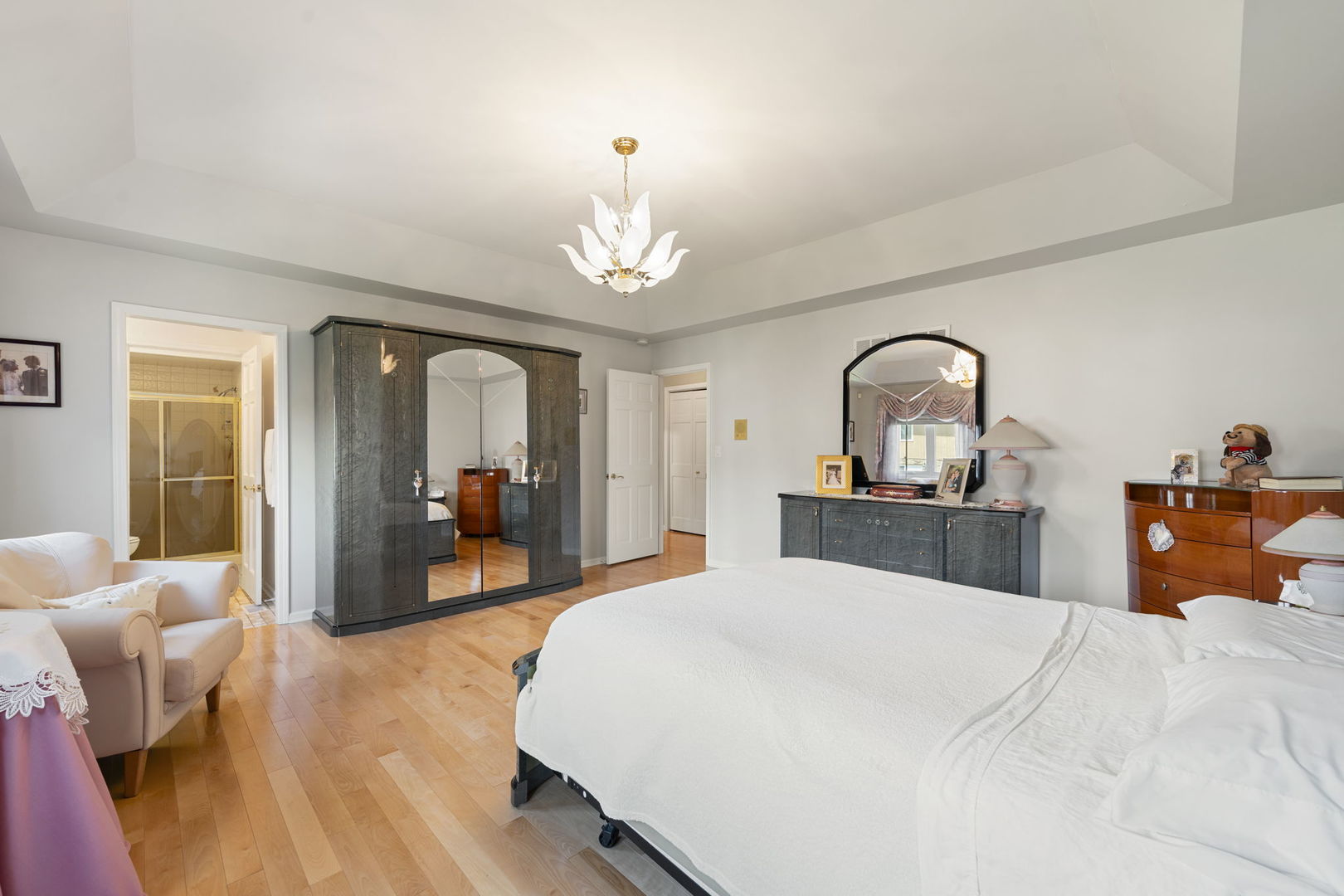 1520 Grove Drive Addison, IL 60101 - Photo 17 of 43 a bed room with a bed and a mirror