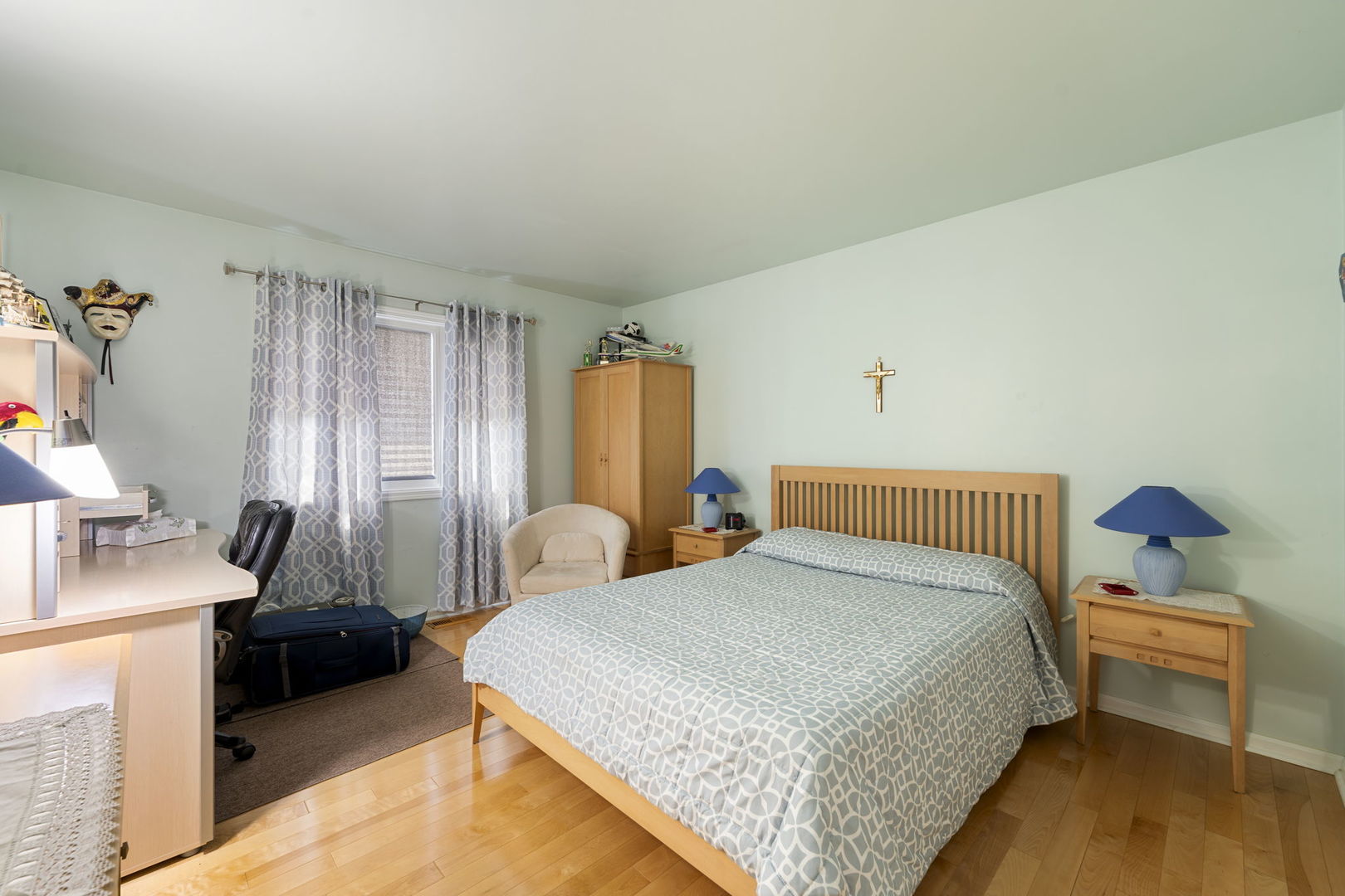 1520 Grove Drive Addison, IL 60101 - Photo 19 of 43 a bedroom with a bed and a chandelier