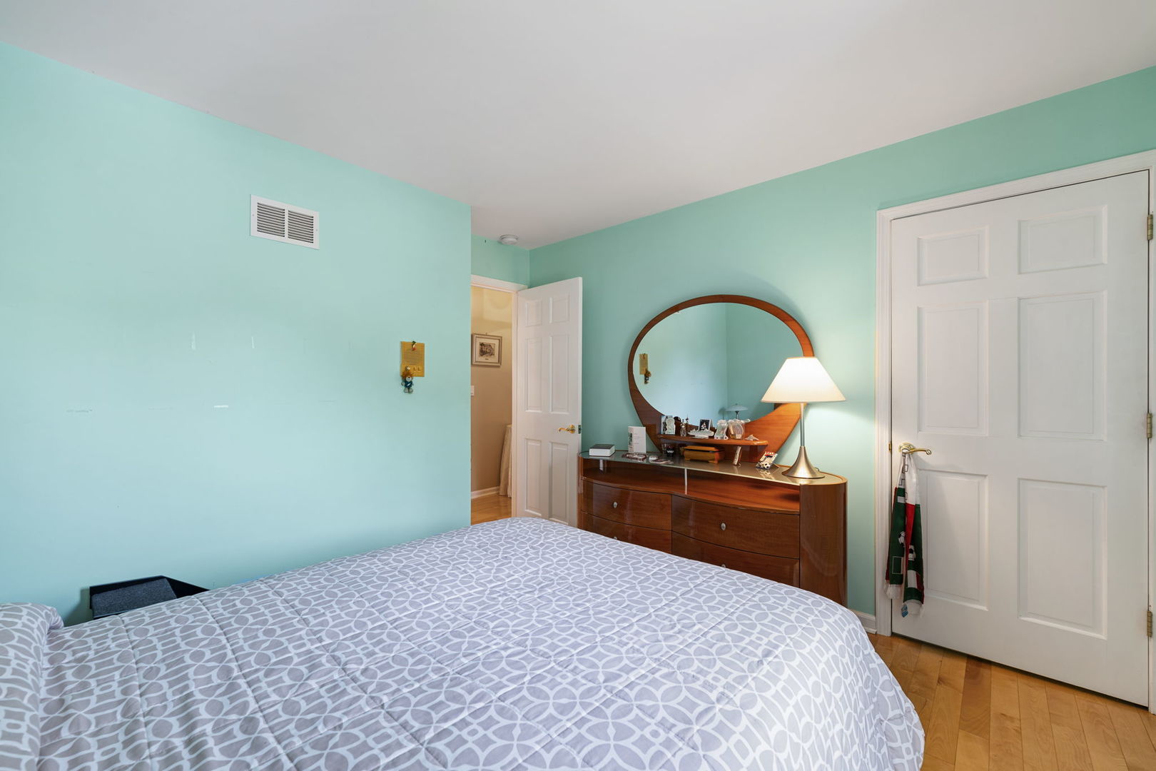 1520 Grove Drive Addison, IL 60101 - Photo 23 of 43 a bedroom with a bed and a dresser