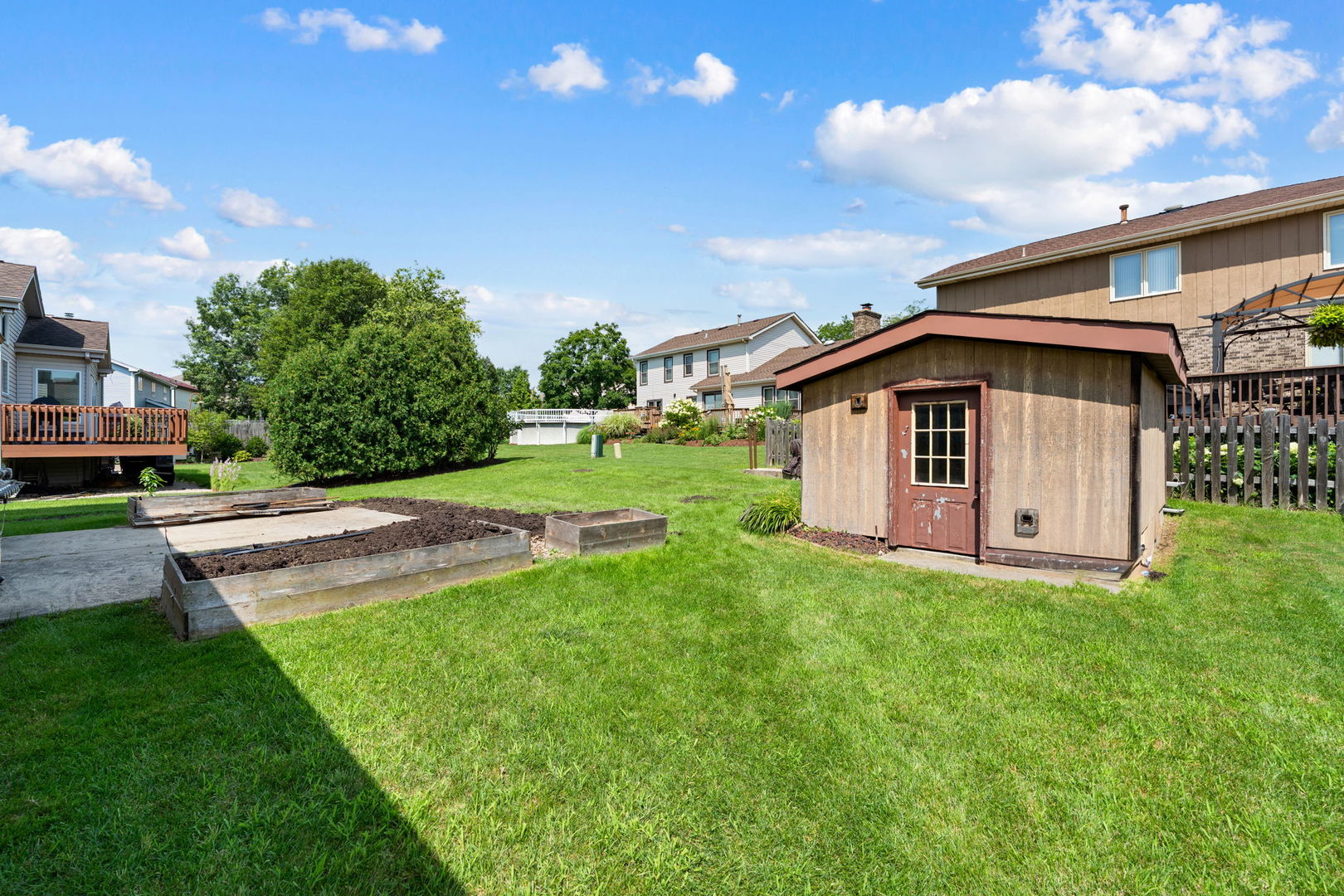 1520 Grove Drive Addison, IL 60101 - Photo 32 of 43 a view of a house with a yard and sitting area