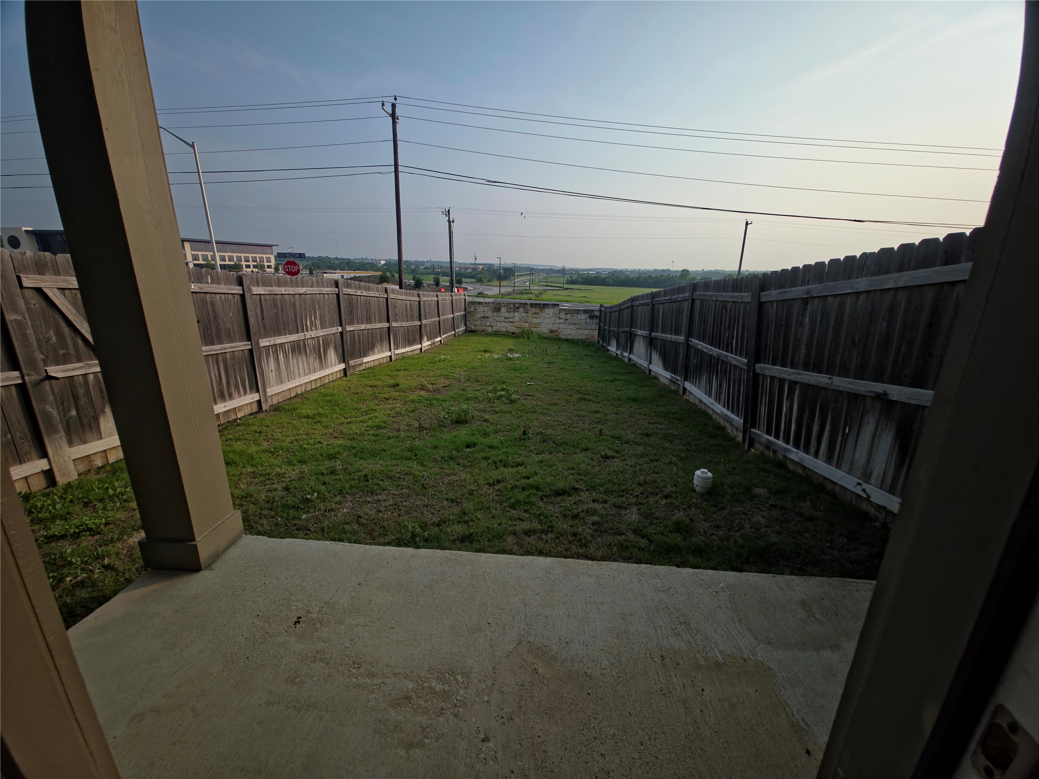 140 Dodge Road Georgetown, TX 78626 - Photo 14 of 14 Private backyard featuring a concrete patio, wood privacy fencing, and a grassy area
