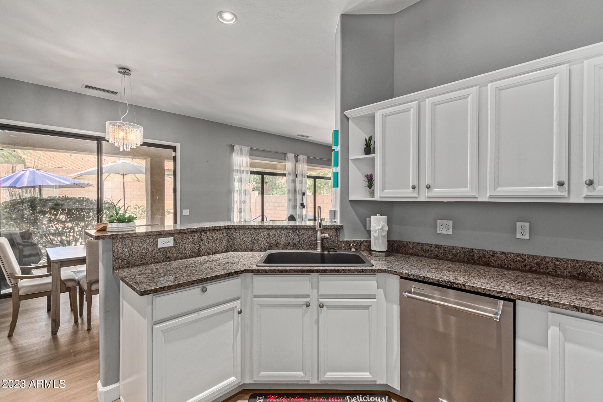 4506 East Jaeger Road Phoenix, AZ 85050 - Photo 12 of 47 Bright white cabinets & granite counters