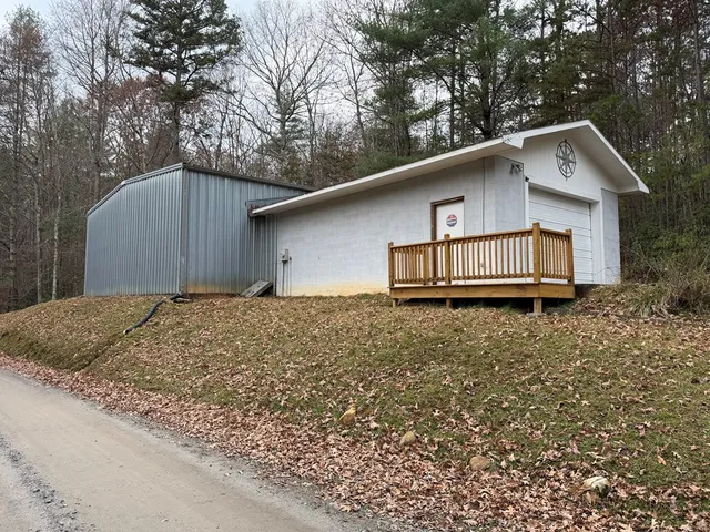 a house that has a tree in front of it