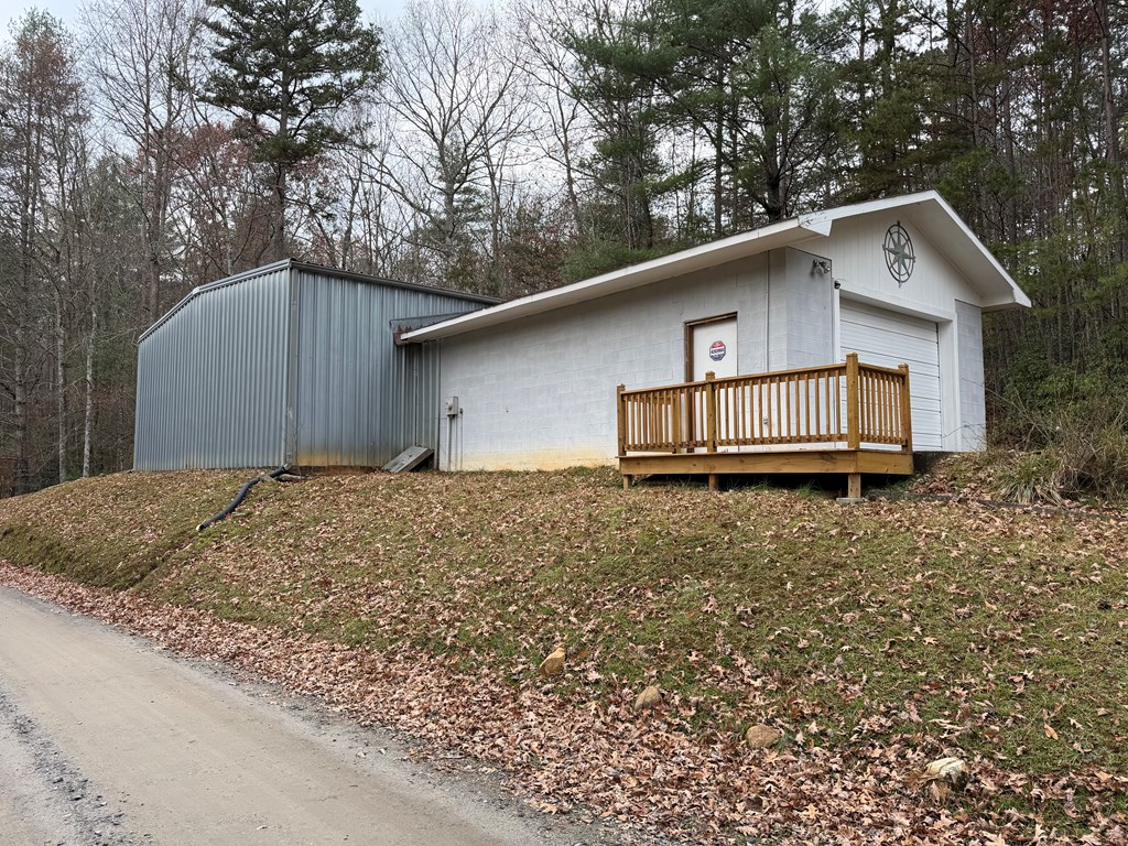 691 Mitchell Branch Road Morganton, GA 30560 - Photo 5 of 7 a house that has a tree in front of it
