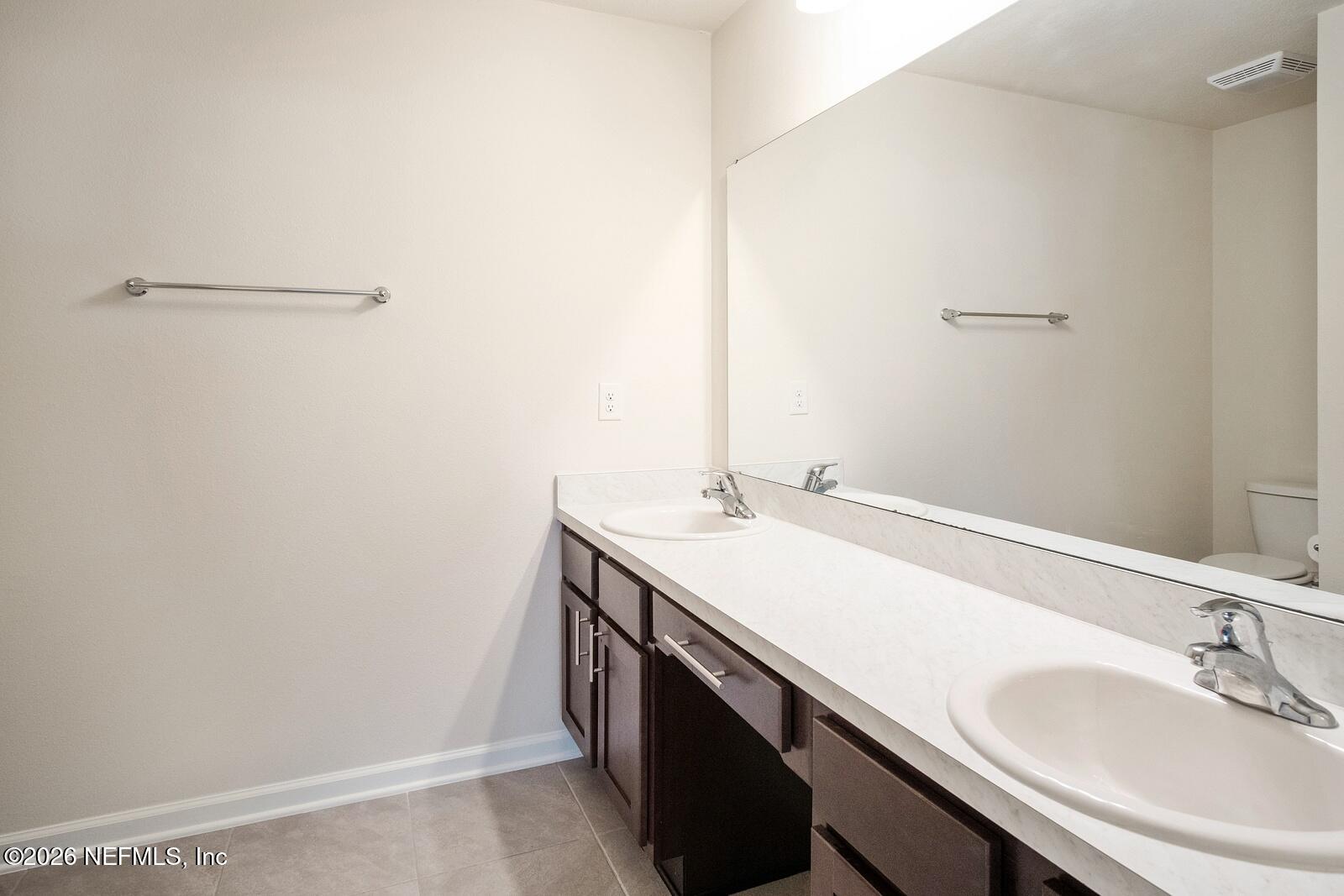 73 Java Lane St. Augustine, FL 32092 - Photo 11 of 18 a bathroom with a sink and a mirror