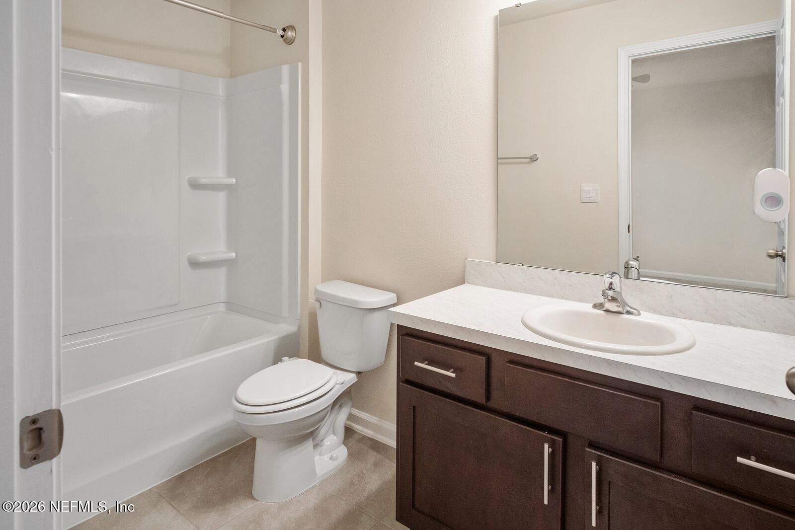 73 Java Lane St. Augustine, FL 32092 - Photo 16 of 18 a bathroom with a sink toilet and shower