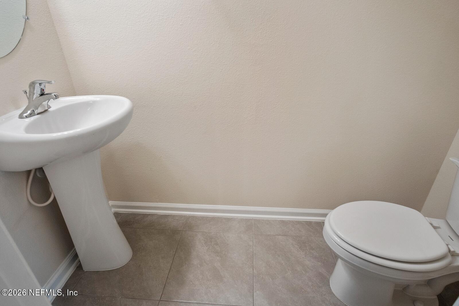73 Java Lane St. Augustine, FL 32092 - Photo 5 of 18 a white toilet sitting next to a white sink