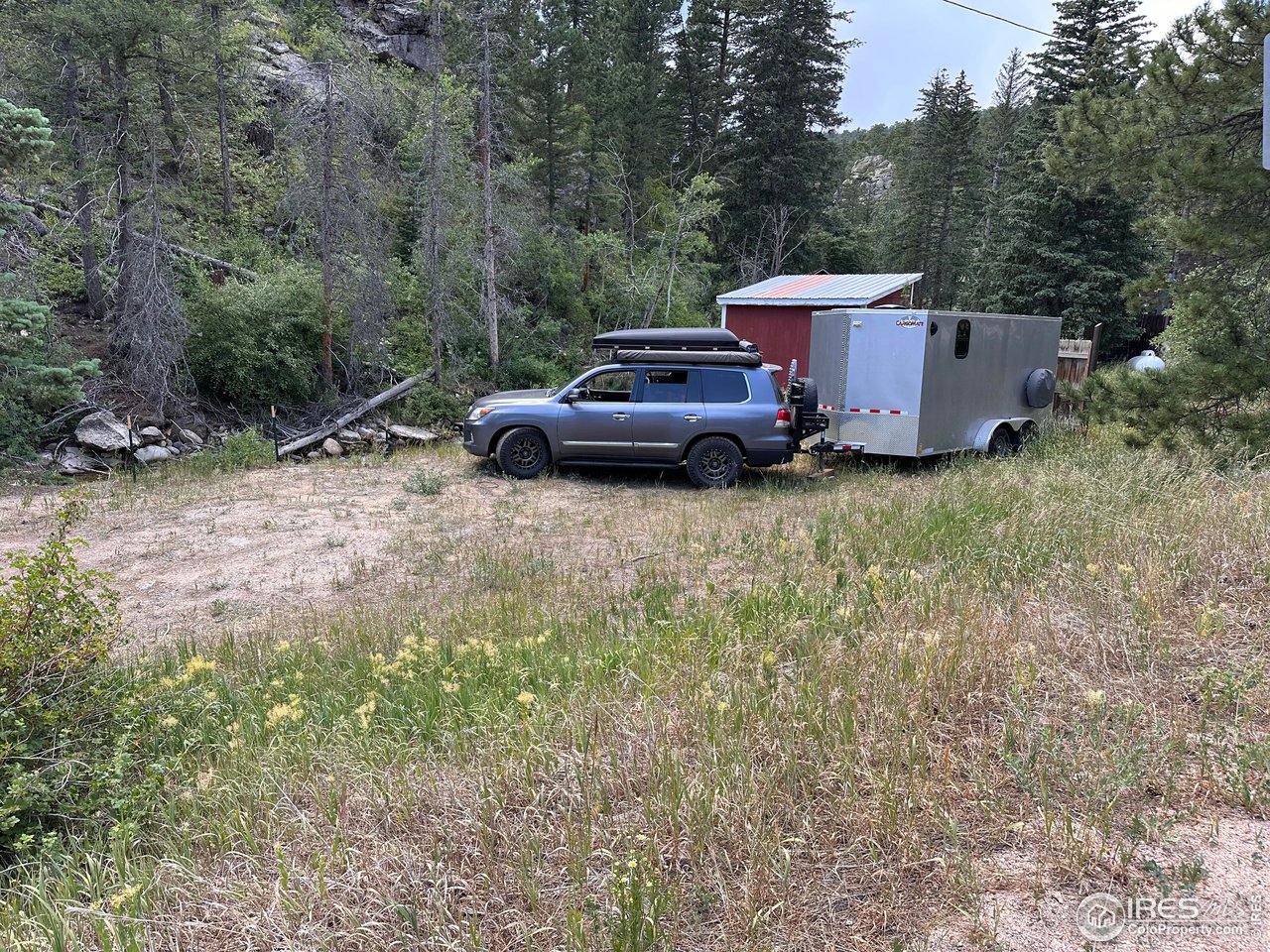 2159 Riverside Drive Lyons, CO 80540 - Photo 18 of 21 a view of a couches under an umbrella
