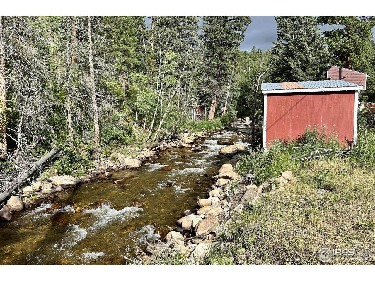 2159 Riverside Drive Lyons, CO 80540 - Photo 5 of 21 a backyard of a house with lots of green space
