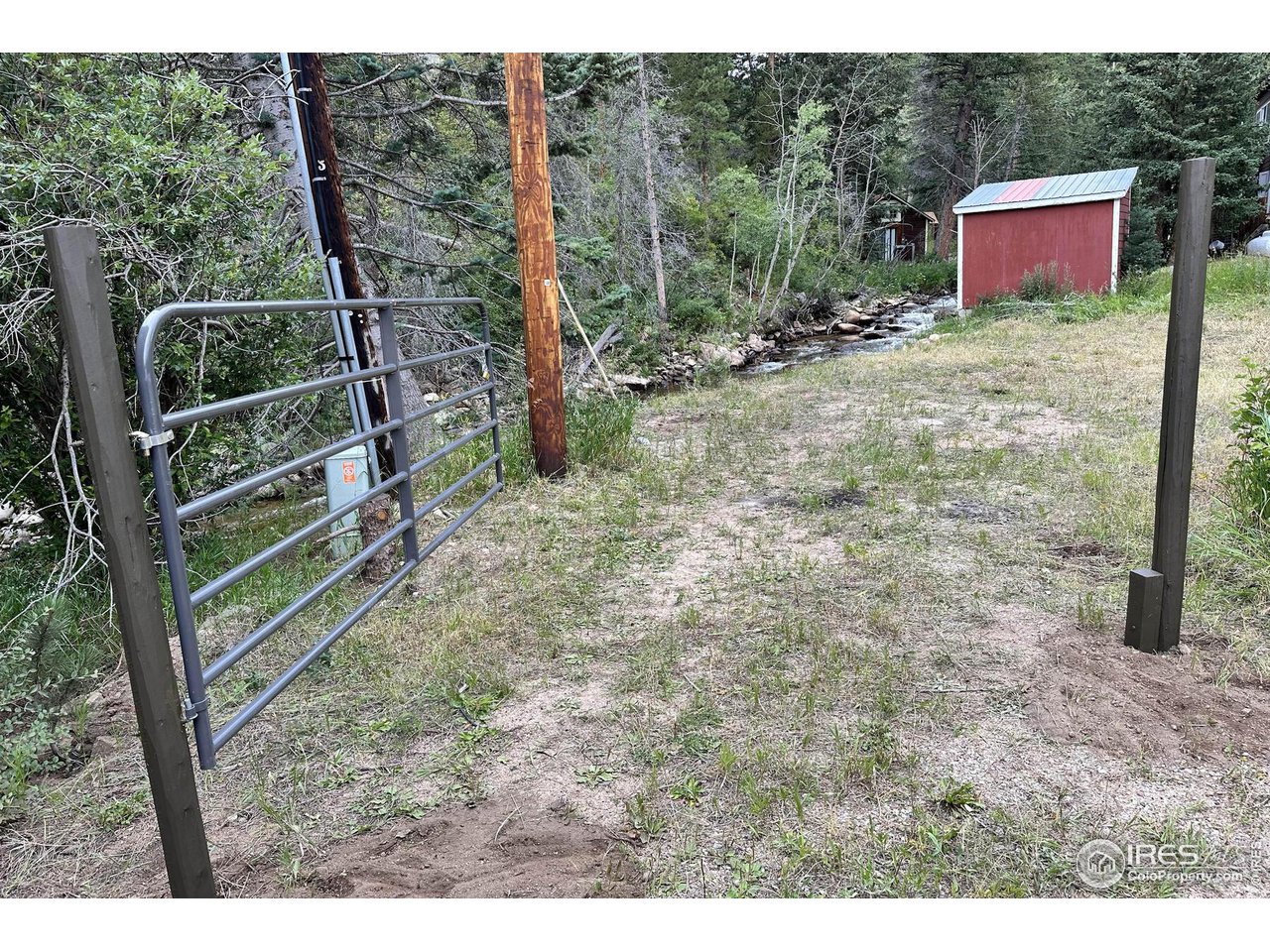 2159 Riverside Drive Lyons, CO 80540 - Photo 10 of 21 a backyard of a house with lots of green space