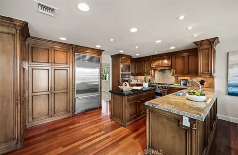a dining room with furniture window and wooden floor