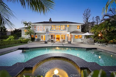 a swimming pool with outdoor seating yard and outdoor seating